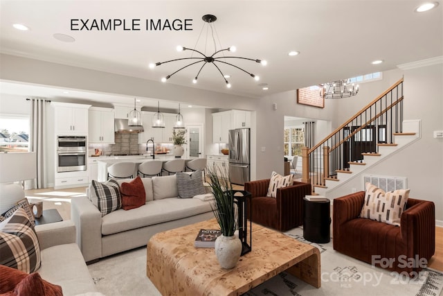 11016 Tyler Brook Ln Unit Oak0036, Mint Hill, NC 28227 - living room featuring a chandelier, recessed lighting, and stairs