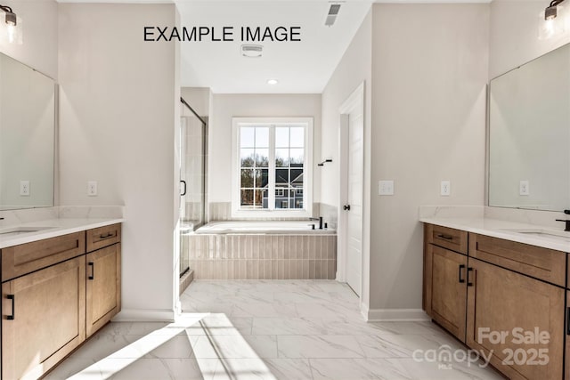 11016 Tyler Brook Ln Unit Oak0036, Mint Hill, NC 28227 - full bathroom featuring marble look tile flooring, two vanities, and a garden tub