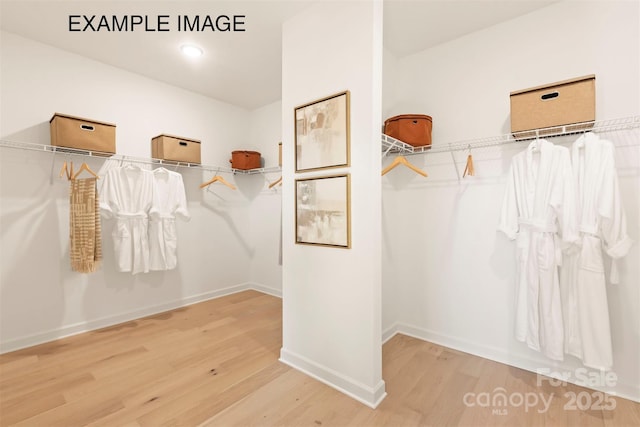 11016 Tyler Brook Ln Unit Oak0036, Mint Hill, NC 28227 - walk in closet featuring wood finished floors