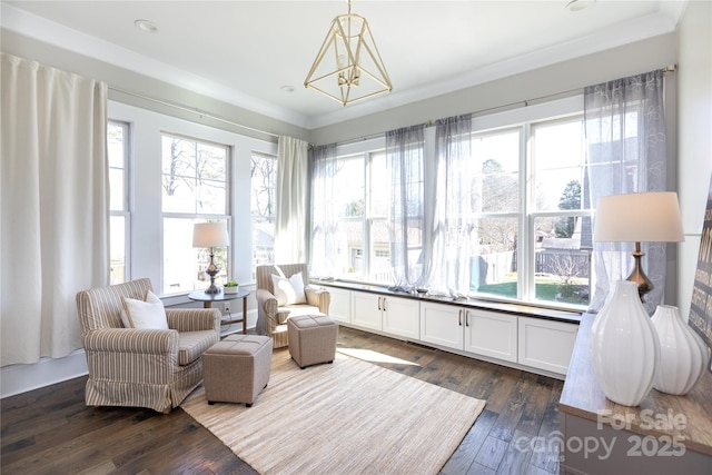 sunroom / solarium with a notable chandelier