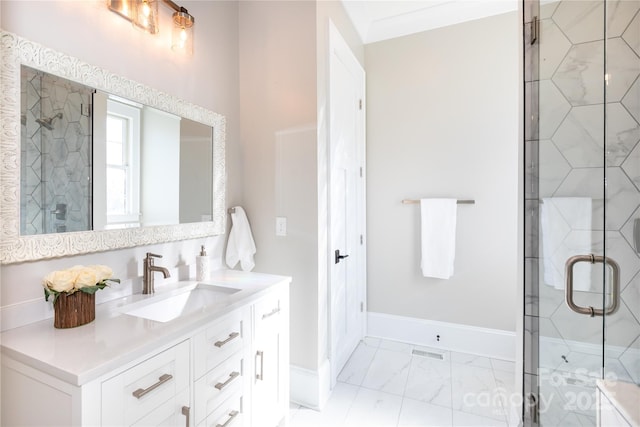 bathroom featuring vanity and an enclosed shower