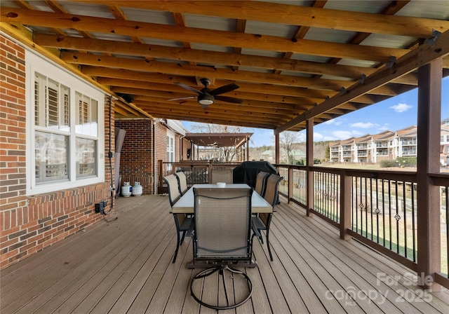 deck with a grill and ceiling fan