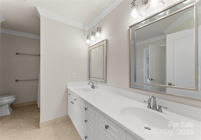 bathroom featuring vanity, crown molding, and toilet