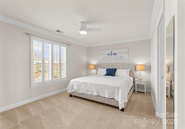 bedroom with ceiling fan, light colored carpet, and ornamental molding