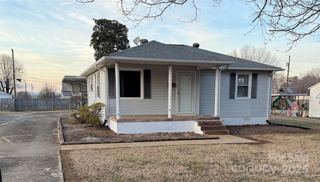 bungalow-style house with a front lawn