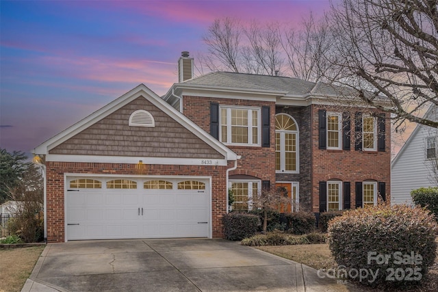 view of front of property with a garage