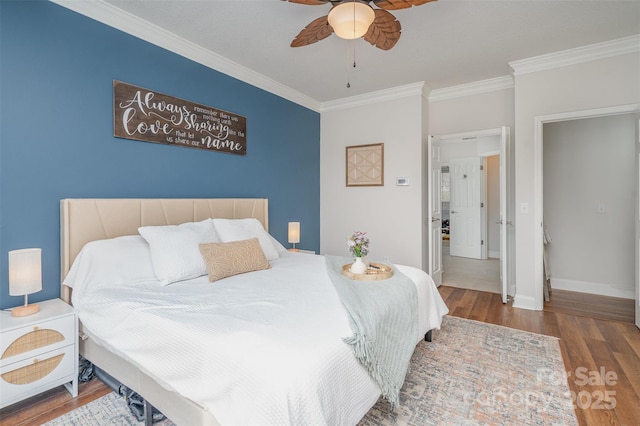 bedroom with ceiling fan, ornamental molding, and hardwood / wood-style floors