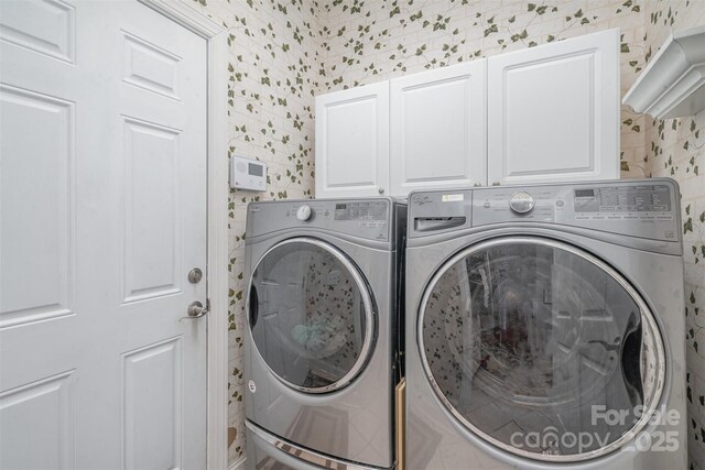 laundry area featuring cabinets and separate washer and dryer