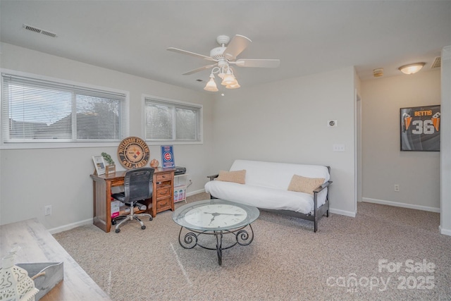 home office featuring light carpet, plenty of natural light, and ceiling fan