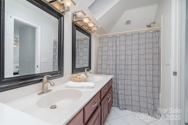 bathroom featuring tile patterned flooring, a shower with shower curtain, and vanity