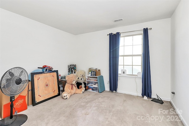 miscellaneous room with carpet flooring, visible vents, and baseboards