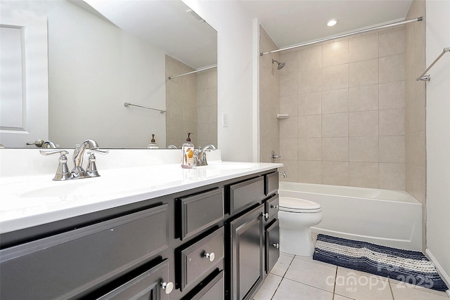 full bath with toilet, shower / bath combination, a sink, tile patterned floors, and double vanity