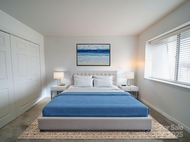 bedroom featuring a closet, carpet, and baseboards