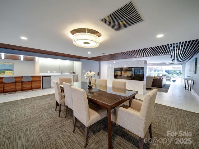 dining space featuring light tile patterned floors, visible vents, and recessed lighting