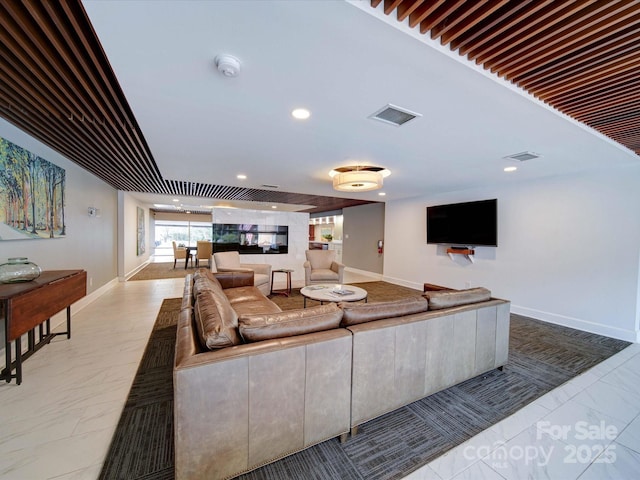 living room with marble finish floor, baseboards, visible vents, and recessed lighting