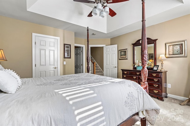 carpeted bedroom featuring ceiling fan and baseboards