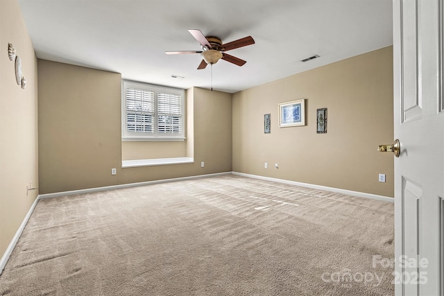 unfurnished room featuring visible vents, ceiling fan, light carpet, and baseboards