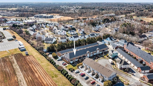 birds eye view of property with a residential view