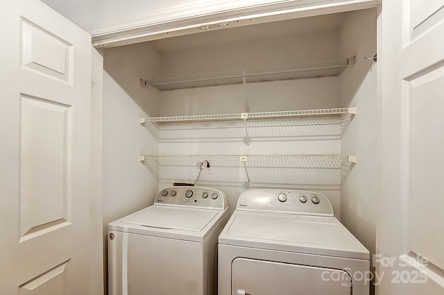 clothes washing area with laundry area and separate washer and dryer