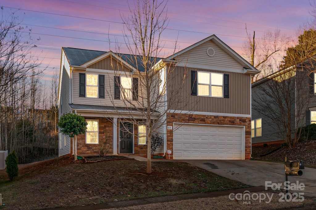 front of property with a garage