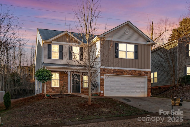 front of property with a garage