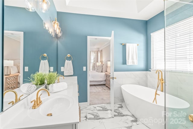 bathroom with a bathing tub and vanity