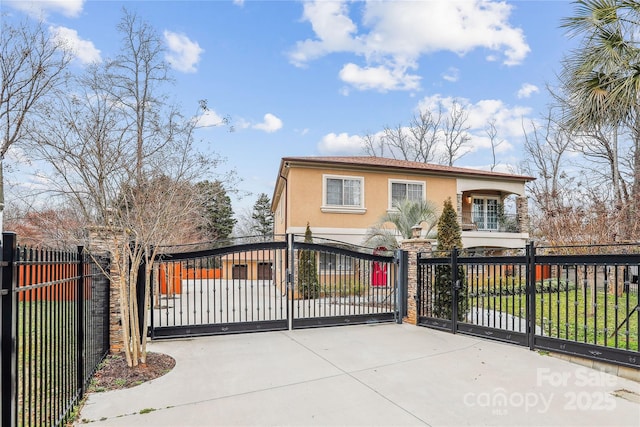 view of gate featuring a fenced front yard