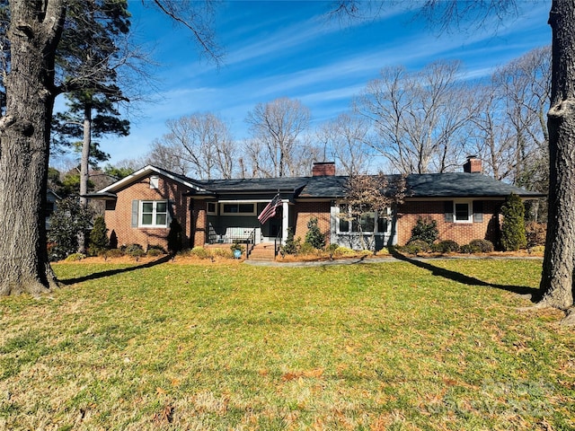 ranch-style home with a porch and a front lawn