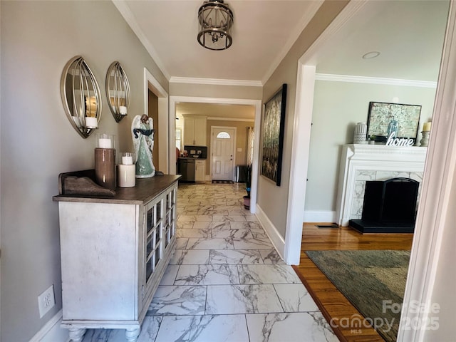 entrance foyer featuring crown molding and a high end fireplace