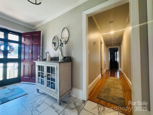 foyer entrance with crown molding and a healthy amount of sunlight