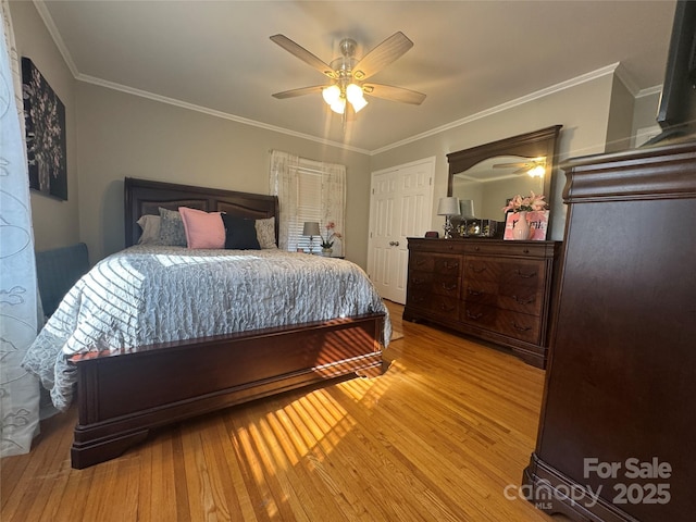 bedroom featuring ornamental molding, ceiling fan, and light hardwood / wood-style floors