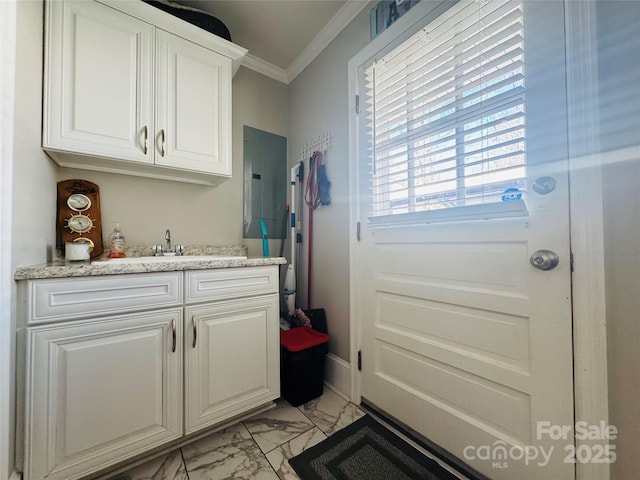 interior space featuring ornamental molding, electric panel, and indoor wet bar