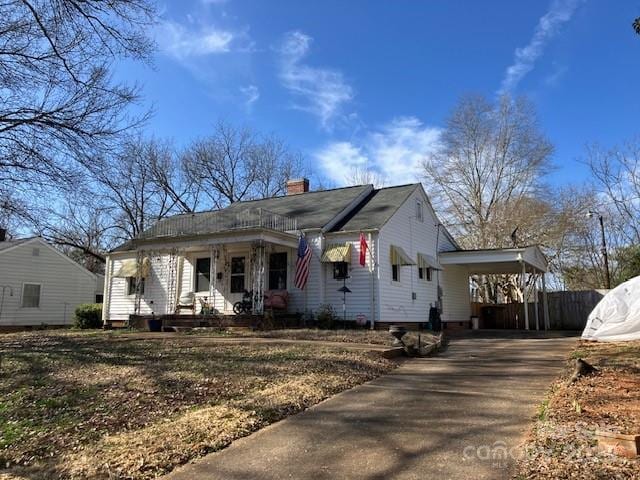 view of front of home with a carport