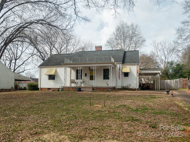 bungalow-style house with a chimney, crawl space, fence, a porch, and a carport