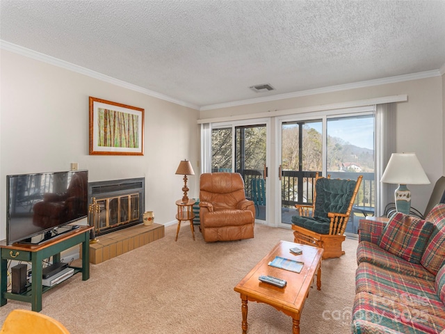 living room featuring crown molding, a fireplace, a textured ceiling, and carpet flooring