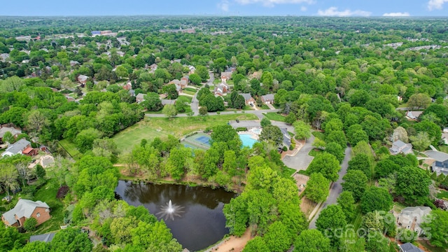 birds eye view of property featuring a water view and a residential view