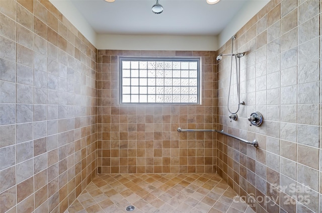 full bath featuring tiled shower