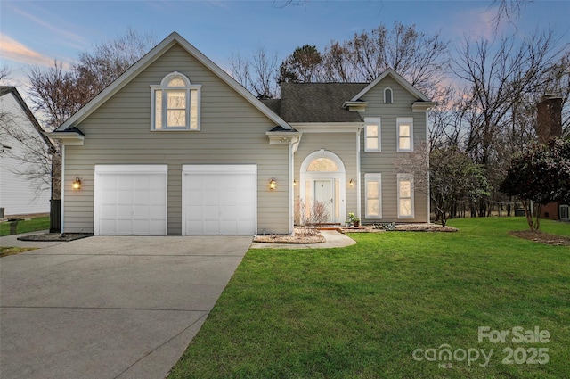 traditional home featuring driveway, a garage, and a front lawn