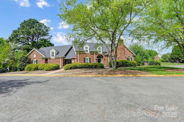 view of front of property featuring brick siding