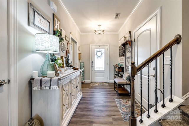 entrance foyer with dark wood finished floors, visible vents, crown molding, baseboards, and stairs