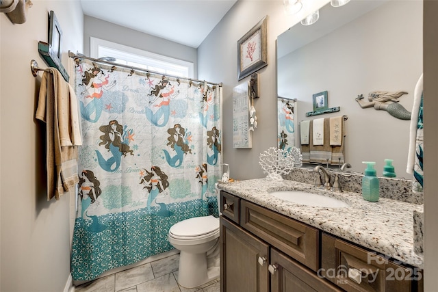 bathroom featuring toilet, tile patterned floors, vanity, and a shower with shower curtain