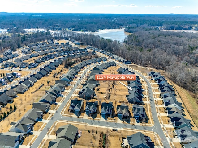 aerial view with a residential view and a wooded view