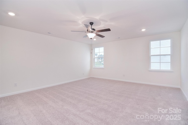 unfurnished room with recessed lighting, light carpet, ceiling fan, and baseboards