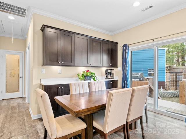 35 Dawson Steele Ct, Asheville, NC 28803 - dining space with attic access, light wood finished floors, ornamental molding, and recessed lighting