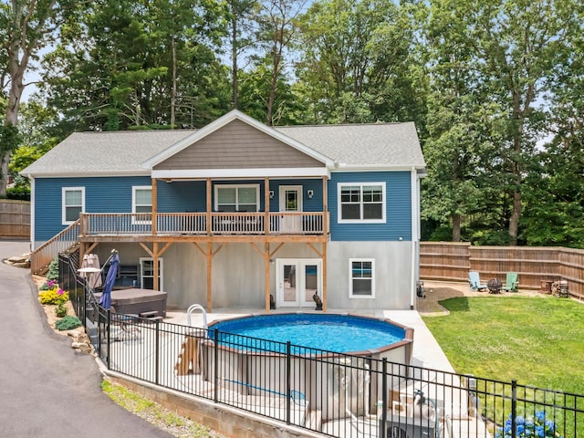 35 Dawson Steele Ct, Asheville, NC 28803 - back of property with a hot tub, a fenced backyard, a patio, and roof with shingles