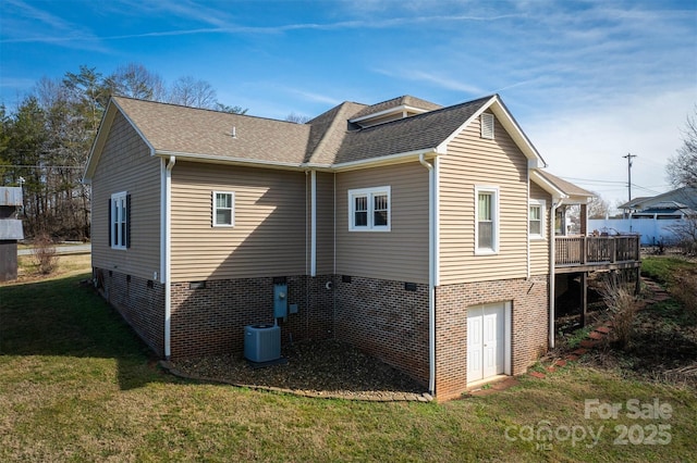 back of house with central AC unit, a yard, and a wooden deck