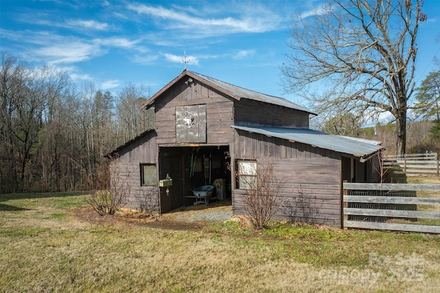 view of outdoor structure with a lawn