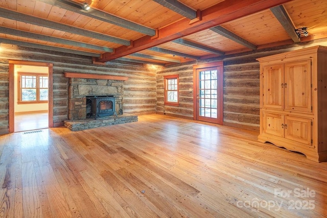 14 Woods Rd, Fairview, NC 28730 - unfurnished living room with light wood-type flooring, a wooden ceiling with exposed beams, healthy amount of natural light, log walls, and a wood stove