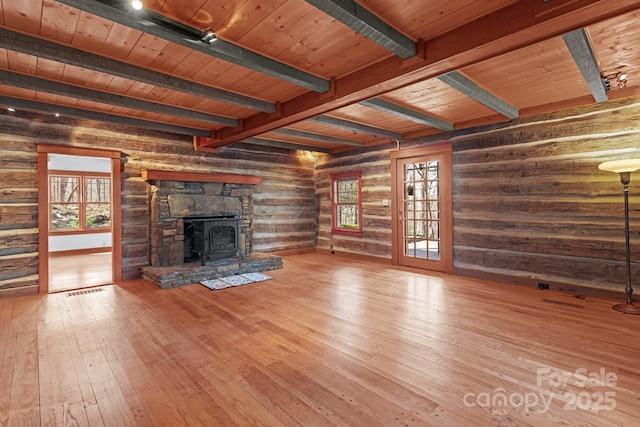 14 Woods Rd, Fairview, NC 28730 - unfurnished living room featuring wood-type flooring, a wooden ceiling with exposed beams, a wood stove, and rustic walls