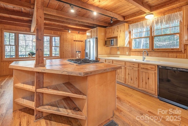 14 Woods Rd, Fairview, NC 28730 - kitchen featuring stainless steel appliances, rail lighting, a wood ceiling with exposed beams, tile countertops, and light wood-style flooring